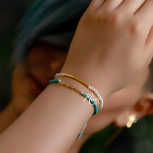 دظستبند مهره و طلا زنانه